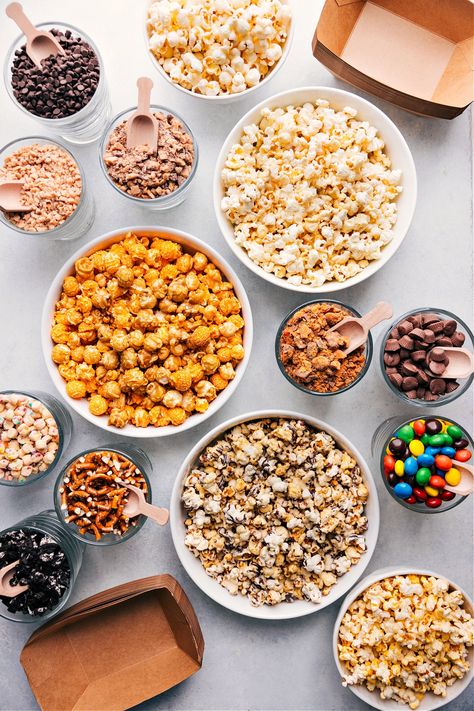 The BEST Popcorn Bar Popcorn Bar Toppings, Gourmet Popcorn Bar, Diy Popcorn Bar, Popcorn Buffet, Popcorn Toppings, Savory Popcorn, Hosting A Party, Movie Night Popcorn, Best Popcorn