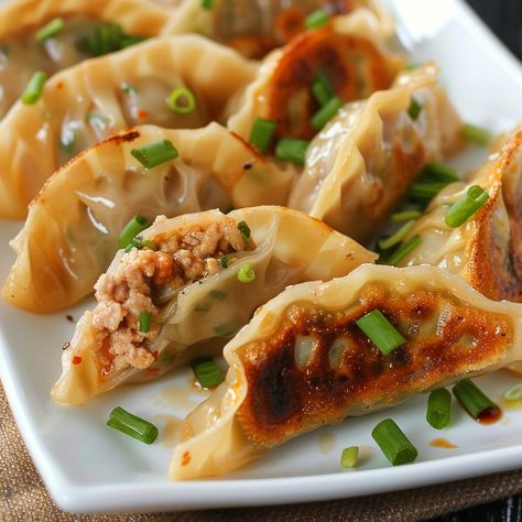 🍜 Dive into delicious Mandu, Korean dumplings! 🥟✨ #ManduMagic #KoreanDumplings Mandu (Korean Dumplings) Ingredients: Ground pork (1 lb) Green onions, finely chopped (1 cup) Garlic, minced (2 cloves) Soy sauce (2 tbsp) Sesame oil (1 tbsp) Ginger, grated (1 tbsp) Dumpling wrappers (1 package) Water (for sealing) Instructions: In a bowl, mix ground pork, green onions, garlic, soy sauce, sesame oil, and ginger. Place a teaspoon of filling in the center of a dumpling wrapper. Moisten edges wit... Mandu Korean, Korean Dumplings, Dumpling Wrapper, Instagram Recipes, Dumpling Wrappers, Korean Street Food, Trending Recipes, Ground Pork, Sesame Oil