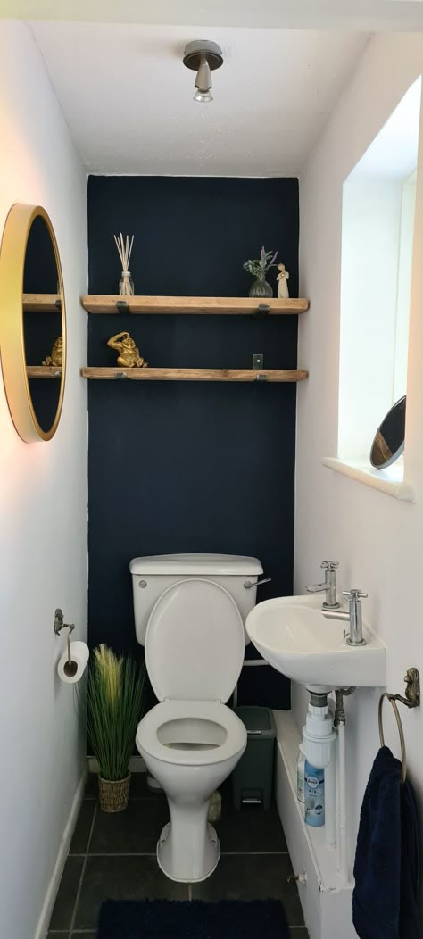 Navy downstairs toilet with gold accessories. Teal Toilet Room, Toilet Accent Wall, Accent Wall Behind Toilet, Sw Cascades, Wall Behind Toilet, Small Wc Ideas Downstairs Loo, Bathroom Wallpaper Accent, Bathroom Wallpaper Accent Wall, Teal Accent Wall