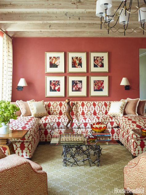 Benjamin Moore's Habanero Pepper is the perfect red to highlight these botanical photographs — especially paired with a bold, graphic couch.   - HouseBeautiful.com Red Couch Decor, Studio Indigo, Red Living Room Decor, Artificial Garden, U Shaped Sectional Sofa, Red Living, Stylish Wall Decor, Simple Wall Decor, Living Room Red