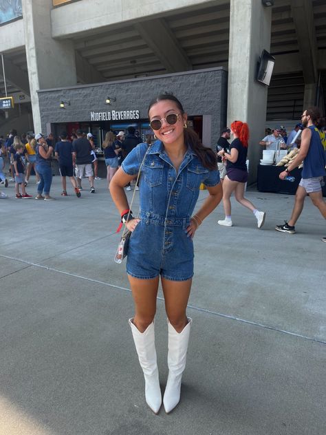 Denim Outfits For Concert, Tall White Cowboy Boots Outfit Concert, Country Concert Outfit Tall White Boots, Country Music Concert Outfit White Boots, Cowboy Boot Gameday Outfit, Romper With Cowboy Boots Outfit, Jean Romper With Cowboy Boots, Gameday Outfit With Cowboy Boots, Game Day Cowboy Boots