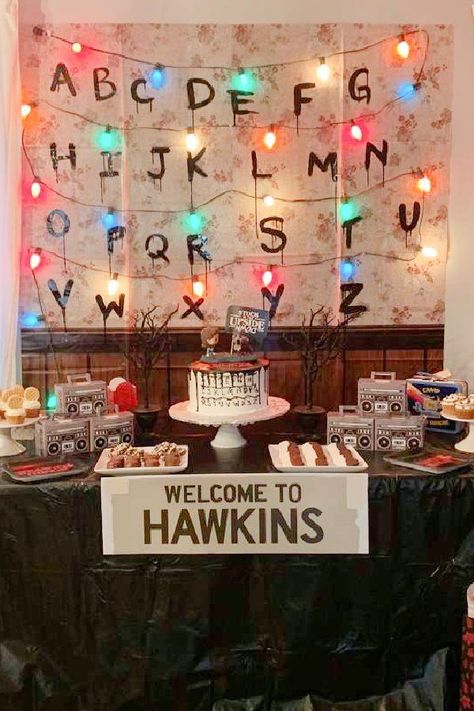 Check out this amazing Stranger Things birthday party! The backdrop is awesome! See more party ideas and share yours at CatchMyParty.com Birthday Party Stranger Things, Stranger Things Birthday Theme, Stranger Things Centerpiece Ideas, Stranger Things Theme Party Decorations, Stanger Thing Birthday, Stranger Things Backdrop, Stranger Things Birthday Party Ideas Decoration, Stranger Things Birthday Decorations, Stranger Things Birthday Party Decorations