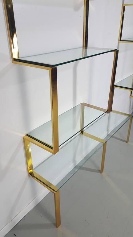 Brass Etagere, Shoe Store Design, Store Shelves Design, Glass Wall Shelves, Retail Store Interior Design, Wall Shelving, Store Design Boutique, Retail Store Interior, Showroom Interior Design