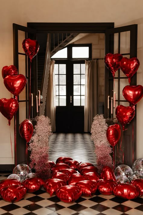 Dozens of red heart-shaped balloons in french door entryway adorned with pin flowers Wedding Decoration Balloons, Proposals Decoration, Valentines Day Event Decor, Valentines Day Wedding Ideas Receptions, Red Decorations Party, Valentine’s Day Wedding, Valentines Day Decorations Party, Valentines Day Room Decor, Valentines Room Decor