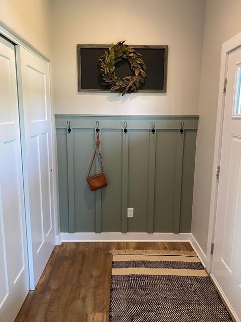 Hallway Drop Zone, Beige Couch Living Room, Hook Entryway, Basement Bathroom Design, Garage Entryway, Mudroom Remodel, Peg Wall, Paneled Walls, Entry Storage