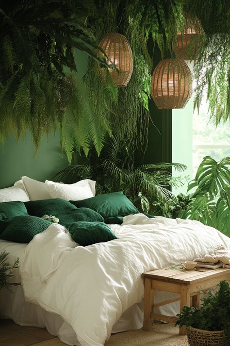 A bedroom filled with lush greenery: ferns, hanging ivy, and tall potted palms. The bed is covered in crisp white linens with forest green pillows. Rattan lanterns hang from the ceiling, casting warm, dappled light. The walls are painted in deep emerald, and a wooden bench at the foot of the bed completes the natural look. --ar 2:3 --style raw --v 6.1 Urban Jungle Interior, Cozy Bedrooms, Space Gallery, Interior Bedroom, Chic Living Room, Chic Living, Stylish Home Decor, Furniture Arrangement, Urban Jungle