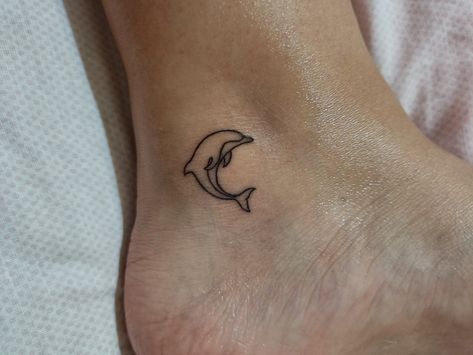 Ankle, Fine line Ocean Tattoos Dolphin, Ankle Dolphin Tattoo, Holiday Small Tattoos, Dolphin Leg Tattoo, Dolphin Tattoo Behind Ear, Dolphin Tattoo On Ankle, Dolphin And Sea Turtle Tattoo, Small Tattoos Dolphin, Mini Dolphin Tattoo