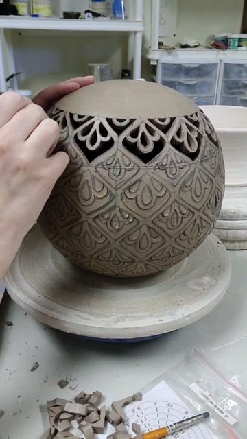 Lyndsey Roberts | Ceramic Arts on Instagram: "The final part of making an oil lamp luminary is carving. I start by laying down a grid, then I block out the initial shape of what I want to carve. Then I go back in and clean up the shapes and put in the detail. I've found that water color pens work best for this because the brush is soft but pointed so I get the detail I want without digging into the clay. Next I use an exacto blade to carve out the shapes, making sure to leave the clay in place u Hand Built Pottery Sculptures & Statues, Carving Clay, Clay Carving, Boho Chic Home Decor, Craft Sculpture, Coil Pottery, Art Coquillage, Ceramic Lantern, Boho Chic Home