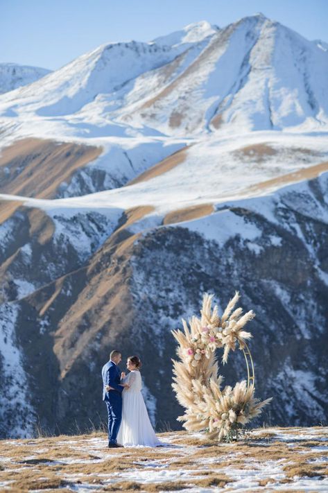 Georgia country, Gudauri. Pampas (Cortaderia) Arch and Snowy Peakse. Wedding ceremony between the sky & heaven Wedding In Mountains, Wedding Photo Art, Event Studio, Georgia Country, Snow Mountains, Mountain Peak, Snow Mountain, Art Event, Winter Wedding