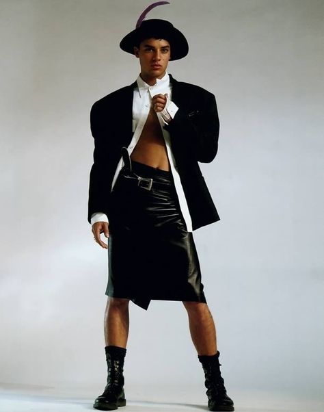 “To me, this is quintessential Ray Petri styling. It’s got the tough stance from the model, which is a very sexy, cool stance. He’s wearing a leather skirt which is a woman’s item of clothing, we have the sexy midriff, strong arms, a touch of vulnerability and a porkpie hat, we’re mixing it all. Is he sexy, is he strong, is it aggressive? The vulnerability and strength of a guy and giving a man the same status as a woman.” Ray Petri, Dm Boots, Meat Dress, The Face Magazine, Trend Board, Reportage Photography, 80s Fashion, Vogue Paris, Mode Inspiration