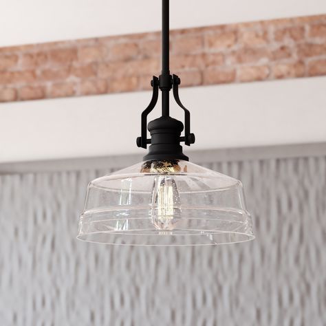 The Beloit pendant adds a welcoming and inviting feel to your kitchen or living spaces. Soft curving lines finished in matte black paired with a large clear seeded glass shade create a look that accents the most comfortable spaces. Combine that with a vintage Edison style filament bulb to complete the look. Bring a level of sophistication to your trendy farmhouse or urban style with this pendant. Cascadia Beloit Matte Black Farmhouse Seeded Glass Dome Medium Hanging Pendant Light | P0380 Light Over Sink, Lights Over Kitchen Island, Trendy Farmhouse, Modern Farmhouse Lighting, Farmhouse Kitchen Lighting, Sink Lights, Black Farmhouse, Large Pendant Lighting, Farmhouse Pendant Lighting