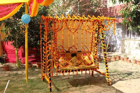 Decoration of swing Jhoola Decoration Ideas, Haldi Backdrops, Ring Exchange Ceremony, Saraswati Pooja, Handmade Wedding Decorations, Haldi Ceremony Decorations, Backyard Party Ideas, Sangeet Decor, Ring Exchange