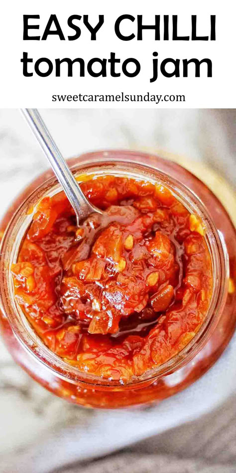 Chilli and tomato jam in glass jar with silver spoon. There is text written at the top of the image. Tomato Chilli Relish, Tomato Chilli Jam Recipe, Chilli Jam Recipe, Tomato Chilli Jam, Tomato Chilli Sauce, Easy Chilli, Tomato Jam Recipe, Most Popular Recipes On Pinterest, Chilli Jam