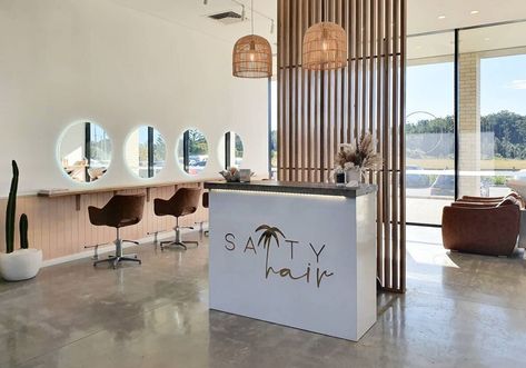 Hair Salon Concrete Floor, California Salon Aesthetic, Long Salon Design, Salon Concrete Floor, Salon With Concrete Floor, Open Concept Salon Ideas, Open Floor Plan Hair Salon, Concrete Salon Floor, Corner Retail Display