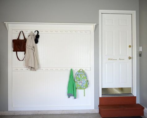 This two-tiered coat rack is super functional for our family because it has a lower rack within reach of the kids, an upper rack for adults, and tons of pegs for all our coats. Plus it’s located in our garage right where we enter our home, which is really convenient. Learn how to make your own!   Here's a sneak peek at the finished project.   Step 1: Start by adding a swath of beadboard wallpaper on the wall that is the width and height of your project. (Tip: Be sure to place your wall… Peg Coat Rack, Diy Beadboard, Pallet Coat Racks, Living Rich, Beadboard Wallpaper, Diy Coat Rack, Shaker Pegs, Diy Coat, Pretty Storage