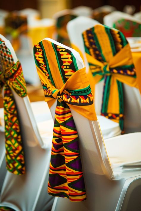 Transform your wedding venue into a cultural haven with vibrant Kente cloth chair sashes. Perfect for an Afrocentric celebration, these sashes add a touch of heritage and style. 🌍💒🎉 Celebrate love with a traditional twist! #WeddingInspiration #AfricanWedding #KenteDesign #WeddingDecor #AfrocentricWedding #CulturalElegance #ChairSashes #WeddingDetails Kente Themed Party, Ghanaian Wedding Traditional Decor, Brown Kente For Engagement, Ghana Traditional Wedding Decoration, African Traditional Wedding Decoration, Northern Kente, Wedding Chair Sashes, America Theme, Kente Cloth