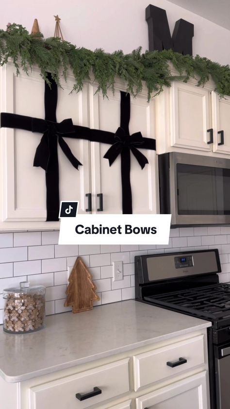 Shayla on TikTok Bow Tie Christmas Cabinets, Christmas Cabinet Bows, Christmas Bow Cabinets, Christmas Bow On Kitchen Cabinets, Cabinet Bows Christmas, Kitchen Cabinet Bows Christmas, Kitchen Cabinet Christmas Bows, Holiday House Decor, Bows Christmas