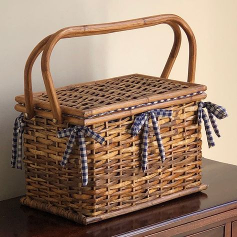 A beautiful late 20th century French Country-style split bamboo picnic basket. This petite basket features a blue and white checked gingham cotton fabric lining with four interior side pockets and eight narrow pockets for silver on the inside lid. Perfect for display or for a quiet picnic for two. Basket itself measures 14” (w) by 9” (d) by 9.5” (h). Picnic Basket Decor, Cute Picnic Basket, Picnic For Two, Cottagecore Life, Picnic Basket Set, Vintage Picnic Basket, Picnic Box, Basket Weaving Diy, Random Products