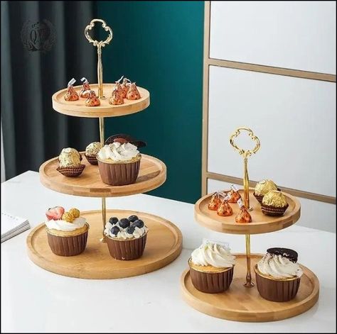 Introducing the Elegant Wooden Tiered Cake Stand, an exquisite addition to any celebration or home decor. This cake stand, crafted with care from high-quality wood, radiates a warm, natural charm, perfect for showcasing your delicious treats. Whether it’s a grand wedding, a cozy birthday party, or a quaint tea gathering, this cake stand effortlessly elevates the presentation of your cakes, cupcakes, and other delightful pastries. Get yours here today: https://favonne.com/elegant-wooden-tiere... Wooden Tiered Cake Stand, Dessert Display Table, Muffin Stand, Cupcake Display Stand, Dessert Display Stand, Cake Stand Set, Wooden Tableware, Wooden Cake Stands, Tiered Cake