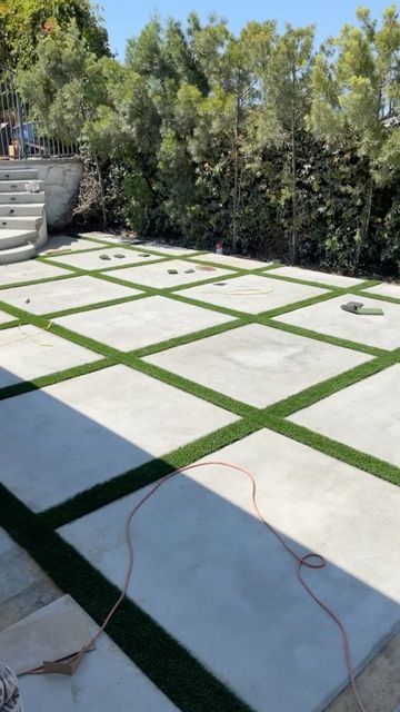 Concrete Blocks With Turf, Cement Pavers With Grass In Between, Paver Turf Patio, Drive Way Paving, Cement Squares With Grass In Between, Cement Backyard Ideas, Outside Flooring Ideas, Grass And Pavers, Diy Courtyard