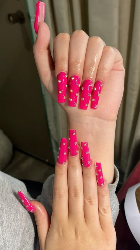 Hot Pink Nails With Pearls, Hot Pink Nails With Diamonds, Hot Pink Acrylic Nails With Rhinestones, Dark Pink Nails With Rhinestones, Pink Nails With Red Rhinestones, Hot Pink Nails With Gems, Hot Pink Nails Rhinestones, Pink Nails Rhinestones, Hot Pink Bling Nails