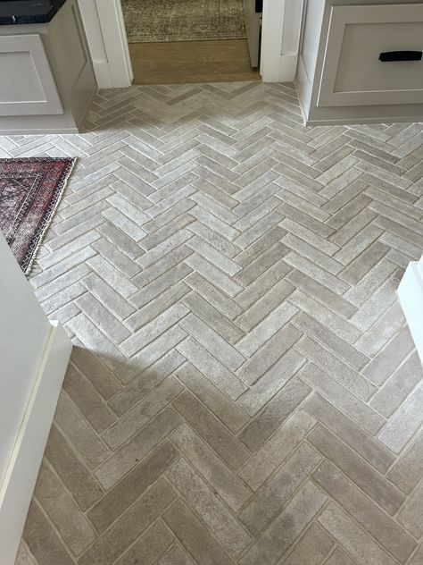 Faux Brick Tile Floor, Herringbone Tile Floor Entryway, Entrance Tile Floor, Foyer Flooring Ideas, Wood And Tile Flooring Combination, Entryway Flooring Ideas Tile, Front Entry Tile, Kitchen Herringbone Floor, Laundry Room Floors