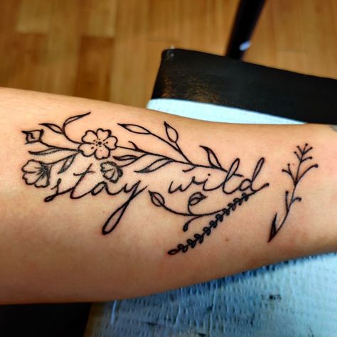 Get Rowdy Tattoo, Country Tattoos For Women Thigh, Wild As Her Tattoo, Small Country Tattoo Ideas, Stay Wild Tattoo With Flowers, Cowboy Up Tattoo Ideas, Punchy Western Tattoo Ideas, Women Tattoos Western, Small Western Hand Tattoos