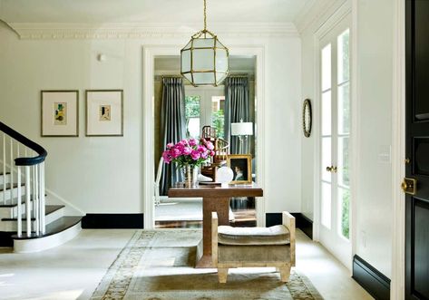 Entry and Hall by Suzanne Kasler Interiors | 1stDibs Black Baseboards, Entry Light, Office Doors, Foyer Staircase, Suzanne Kasler, Interior Design Minimalist, White Crown, Geometric Lighting, Foyer Decorating