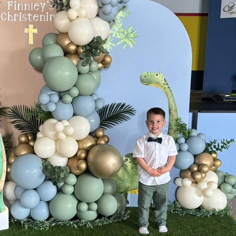 **CUSTOMER PHOTO** How adorable does little Finnley look against his Dino display 🥰 Cake by - Hmm Cakes #dinosaur #christening #christeningparty #dinosaurballoons #balloons #balloondecor #bapiaparty #balloons2business #blissfulballoonz Dinosaur Backdrop, Balloon Displays, Balloons Wall, Display Cake, Dinosaur Balloons, Christening Party, Balloon Display, Cake Display, Balloon Wall