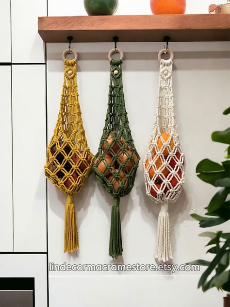 Thanks so much for visiting our store, we make macrame products in various colors, sizes, styles, all 100% natural materials, pure soft cotton cords with clean color and no bad smell at all ^^ Macrame Hanging Fruit Basket perfect for softing and organizing produce, vegetables, fruits in style boho. Bag handmade storage unit is designed to hang in your kitchen or pantry, maximizing space and keeping your produce fresh and easily accessible. Say goodbye to countertop clutter and hello to a more or Macrame Fruit Hammock Diy, Macrame Fruit Hanger Diy, Fruit Basket Ideas Kitchen, Fruit Storage Ideas, Hanging Produce Basket, Hanging Macrame Basket, Macrame Fruit Basket, Practical Macrame, Hanging Vegetable Basket