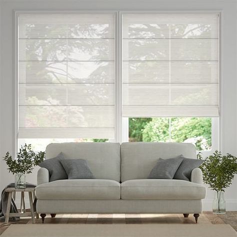 We love a bright and airy spaceand this Madagascar Voile Neutral Roman Blind offers brightness in spades. Neutral Roman Blinds, Roman Blinds Bedroom, Roman Blinds Living Room, Blinds For Large Windows, Blinds For Windows Living Rooms, Cortina Roller, Beautiful Blinds, Sheer Blinds, Roman Curtains