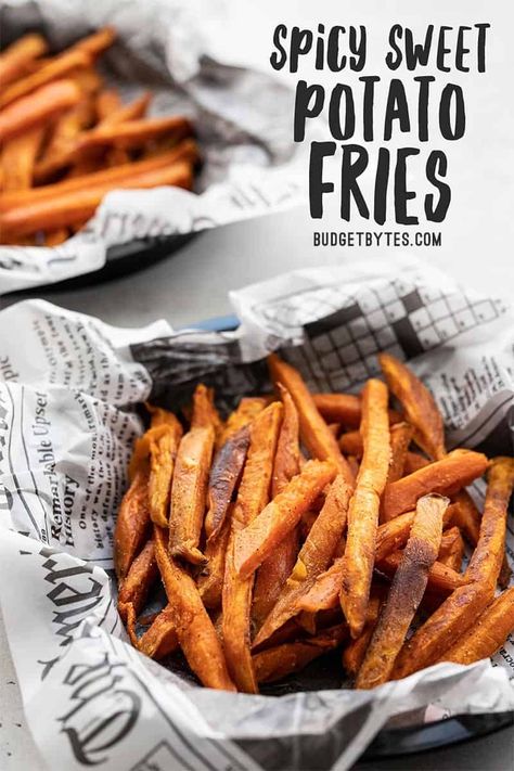 These Spicy Sweet Potato Fries are an easy side dish with a sassy sweet and salty flavor combination, plus a spicy Creole seasoning kick! Budgetbytes.com #sidedish #sweetpotatoes Spicy Sweet Potato Fries, Oven Fried Potatoes, Vegan Honey, Winter Dinners, Potato Chip Recipes, Crispy Sweet Potato Fries, Crispy Sweet Potato, Budget Bytes, Budget Recipes