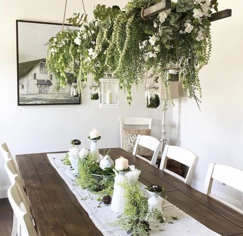 I love the farmhouse style of this dining room, but I love the abundance of plants even more! The hanging plants are definitely a staple piece for the room. #home #homedecor #homedecorideas #homedesign #farmhouse #farmhousedecor #farmhousestyle #farmhousediningchairs #farmhousediningroom #diningroom #diningroomideas #diningroomdecorating #diningroomdecor #inspiration Plant Dining Room, Sunroom Dining Room, Sunroom Dining, Sunroom Decorating, Hanging Plants Indoor, Diy Chandelier, Room Display, Diy Farmhouse Decor, Farmhouse Wall Decor