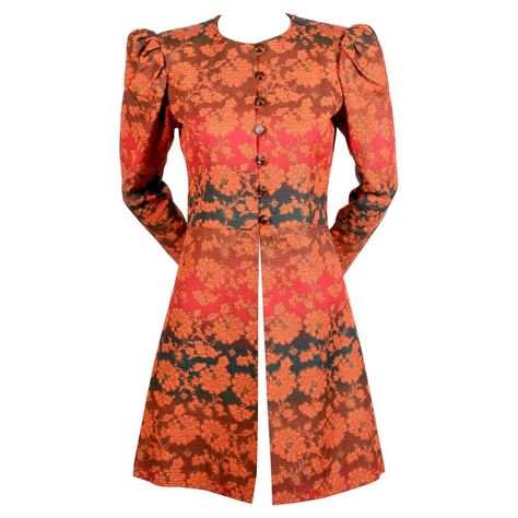 Vivid gradient colored floral coat with puff sleeves from Yves Saint Laurent dating to the 1960. Coat best fits a US size 2 or 4. Approximate measurements: shoulder 14", bust 35", empire waist 30", arm length 23", underarm to cuff 16.5" and overall length 34". Fabric is a sturdy cotton twill blend. Fully lined. Brown button closure. Metal zippers at wrists. Made in France. Excellent condition. Astrakhan Coat, Quilted Jacket Pattern, Batik Kombinasi, Floral Coat, Black Velvet Jacket, Casual Blazer Women, Designer Coats, Batik Fashion, French Fashion Designers