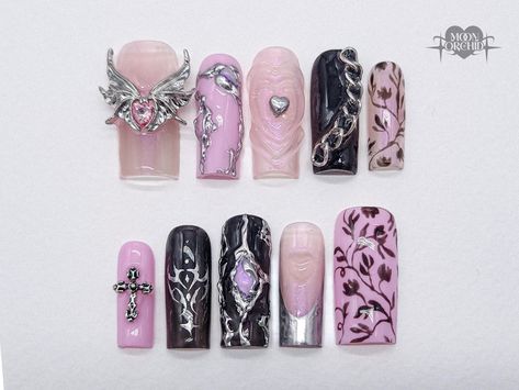 The feminine, supernatural energy in this set is perfect for spooky season, cons, and daily wear. Complete with lots of charms, silver, florals, energy orbs and plenty of hearts. All details are unique and hand painted onto each nail.   **The thumb charm is a statement nail and may appear larger on shorter styles.  High quality, hand painted, press-on nails made to order.  Each order comes with:  ♥ 10 press-on nails  ♥ Orange wood cuticle stick  ♥ Mini file ♥ Nail glue Choose from 4 shapes: ♥ Al Pink Nails Floral, Manicure Pink Nails, Nail Bat, Pink Vampire, Nails Birthday, Bat Nails, Nails Floral, Statement Nail, Vampire Goth