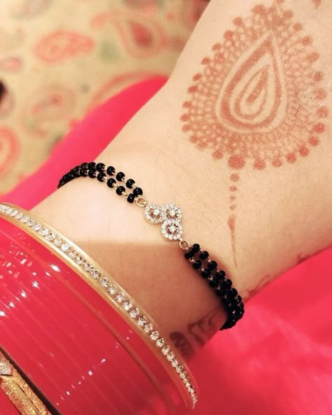 5 Gorgeous Mangalsutra Bracelets We Spotted On Instagram! Hand Mangalsutra, Mangalsutra Bracelet, Black Beads Mangalsutra, Indian Jewelry Earrings, Black Beads Mangalsutra Design, Diamond Pendants Designs, Diamond Mangalsutra, Gold Mangalsutra Designs, Black Beaded Bracelets