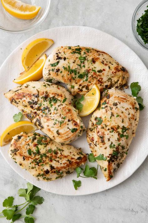 Enjoy flavorful Marinated Lebanese Cilantro Chicken with garlic and lemon. Perfect for quick dinners, and freezer and meal prep friendly! | Cilantro Chicken | Marinated Cilantro Chicken | Marinated Chicken Breasts Recipe | Lemon Cilantro Chicken | Lebanese Cilantro Chicken | Lemon Cilantro Chicken, Lebanese Lemon Chicken, Cilantro Lime Chicken Meal, Lemon And Herb Chicken Marinade, Garlic Lemon Herb Mediterranean Chicken, Lemon Thyme Chicken Marinade, Healthy Ramadan Recipes, Herb Chicken Recipes, Cilantro Chicken