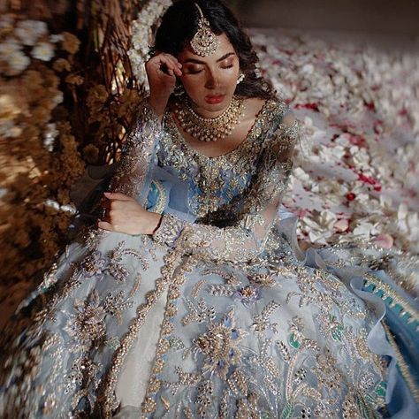 A shimmer saga.  An exquisitely crafted bridal look, paints a gorgeous portrait! What do you feel about this ice blue palette? . . . Courtesy - Outfit : @elanofficial Double Layer Frock, शादी की तस्वीरें, Princesses Disney, Desi Wedding Dresses, Asian Wedding Dress, Asian Bridal Dresses, Bridal Dresses Pakistan, Pakistani Wedding Outfits, Bridal Dress Fashion