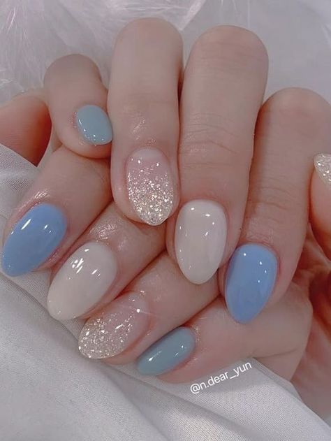 light blue nails: elegant Light Color Nails Short, Light Blue Nails Almond Short, Peach And Light Blue Nails, Pale Blue Nail Designs, Light Blue And Light Pink Nails, Baby Blue Silver Nails, Colorful Bridal Nails, Light Blue Gradient Nails, Opal Blue Nails