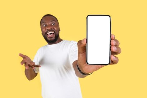 Photo emotional african american guy sho... | Premium Photo #Freepik #photo #man-mobile #man-phone #showing-phone #people-phone Man Holding Phone, Smartphone Ads, American Guy, Graphic Design Tutorials Learning, Photoshop Design Ideas, Smiling Man, Man Standing, Psd Icon, Black Man