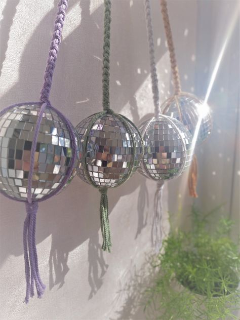 A gorgeous macrame disco mirror glitter ball, that will brighten up any room. Hang it up in a sunny spot and watch the specs of light dance across the room, and even on a cloudy day it make a lovely décor piece. They also make lovely unique gifts for any special occasion. You can hang the disco ball using S hook on a curtain rail, or on a using wall/ceiling cup hook or command hook. You can hang the disco ball using S hook on a curtain rail, or on a using wall/ceiling cup hook or command hook. C Garden Patio Decor, Command Hooks, Curtain Rails, Macrame Boho, Mirror Ball, Mirror Tiles, Room With Plants, Cloudy Day, Macrame Projects