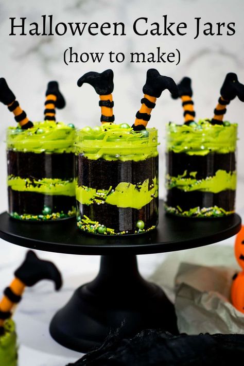 Get ready for some Halloween fun with these cute witches' brew Halloween cake jars! With delicious layers of rich chocolate cake, vibrant green buttercream and matching sprinkles, these treats are perfect for adding a touch of magic to your Halloween party. And the best part? Little witches' legs on top, made entirely in fondant. Get the full tutorial! #halloweencakejars #halloweencake #cakejars #cakesinjar #easyhalloweencakejars #halloweencakejarsdecoration #decoratedtreats Halloween Cake Cones, Halloween Cake In A Jar, Witch Hat Desserts, Halloween Mini Dessert Cups, Halloween Cake Cups, Halloween Mini Cakes Ideas, Witches Cupcakes, Halloween Decorated Cakes, Easy Halloween Cake Decorating