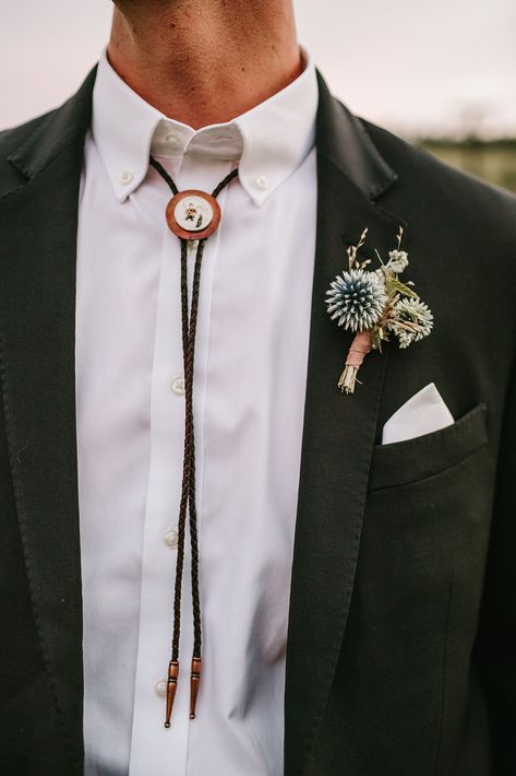 Tux With Bolo Tie, Vintage Mens Wedding Attire, Bolo Tie Tuxedo, Mens Bolo Tie Wedding Outfit, Folk Groom Outfit, Tie Alternative Men, Black Suit Bolo Tie, Mens Bolo Tie Wedding, Alternative Wedding Suits Men