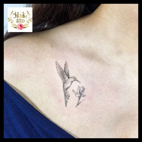 Small Hummingbird Tattoo With Sunflower, Hummingbird With Tulip Tattoo, Behind Ear Tattoo Hummingbird, Hummingbird Tattoo On Chest, Collarbone Hummingbird Tattoo, Tulip And Hummingbird Tattoo, Hummingbird Tattoo Shoulder For Women, Minimalist Hummingbird Tattoo With Flowers, Hummingbird Rose Tattoo