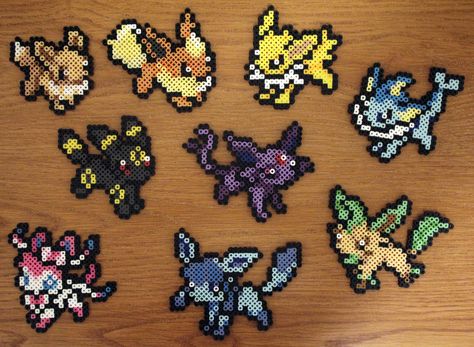 Perler Fuse Bead Eevee and it's 8 Eeveelutions by PkmnMasterTash Pokemon Perler Bead Patterns Eevee, Eevee Evolutions Perler Beads, Evee Evolution Perler Beads, Eevee Perler Beads, Eeveelutions Perler Bead Patterns, Eevee Perler Bead Patterns, 3d Pokemon Perler Beads, Perler Beads Pokemon, 3d Pokemon