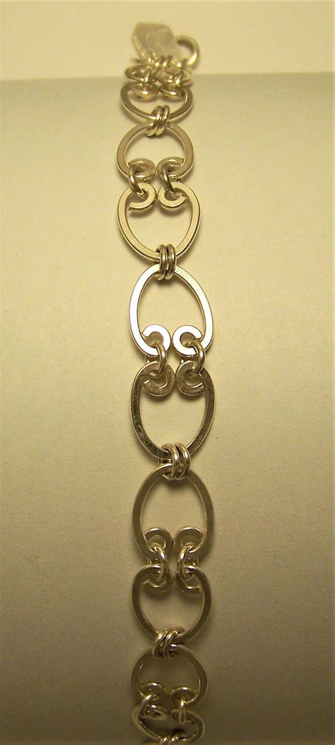 Handmade opposing "owl eye" findings hand linked to create this interesting necklace. Each finding is hand wrapped around a fixture then rolling mill flattened to make the link. Fourteen of these findings are then hand linked to a length of eight and one half inches. Clasp is an 8mm spring ring attached to a soldered catch ring for strength. Finish is steel shot tumbled then hand polished Interesting Necklace, Jewelry Links, Wire Jewelry Patterns, Link Jewelry, Handmade Jewelry Findings, Wire Wrap Jewelry Designs, Rolling Mill, Bijoux Fil Aluminium, Bracelets Handmade Diy