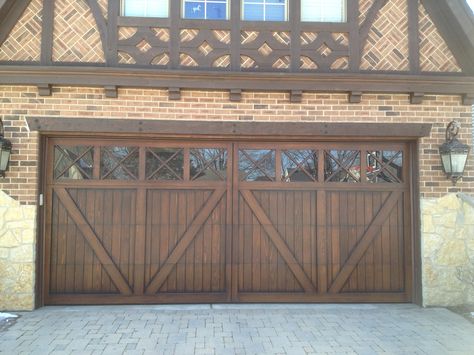 Wood Carriage House Garage Door. Tudor garage door. www.garagedoorwebsite.com Tudor Garage, Barn Door Garage, Cheap Garage Doors, Garage Door Trim, Carriage Style Garage Doors, Garage Door Sizes, Garage Door Colors, Carriage House Garage Doors, Garage Door House