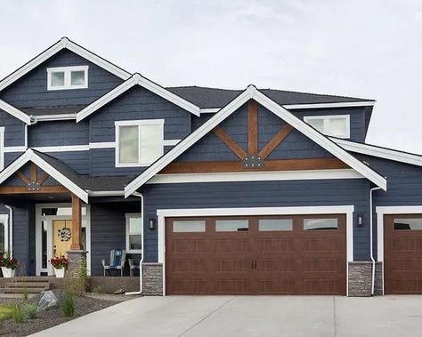 Slate Blue House Exterior With Cedar, Dark Blue House With Wood Accents, Dark Blue House Exterior Black Windows, Navy House Black Door, Dark Exterior With Cedar Accents, Navy Craftsman Exterior, Smokey Blue House Exterior, Blue House Wood Garage Door, Navy Blue House Exterior With Cedar