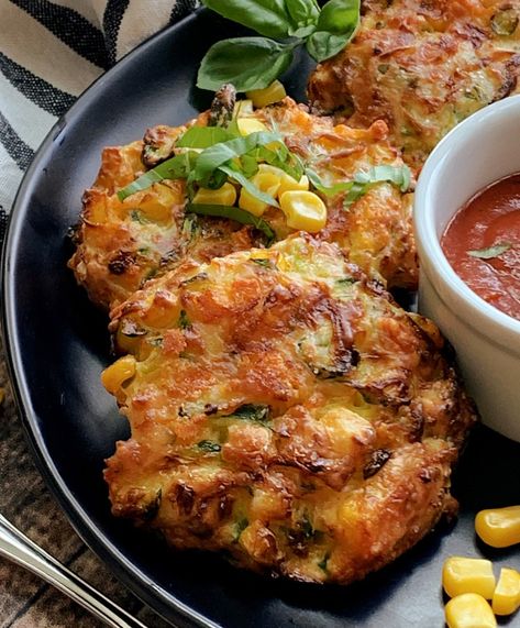 Cheesy Air Fryer Zucchini Corn Fritters (with skillet option!) - shredded zucchini, sweet corn and cheddar cheese air fried to crisp. Easy, delicious snack, lunch or side dish.  #airfryerzucchinifritters #airfryer recipes #airfryer #zucchini #zucchinirecipes #zucchinicornfritters #easyairfryerrecipes #agoudalife Airfryer Zucchini, Air Fryer Zucchini Fritters, Shredded Zucchini Recipes, Recipes Airfryer, Zucchini Cheddar, Zucchini Corn Fritters, Air Fryer Zucchini, Veggie Fritters, Corn Fritter Recipes