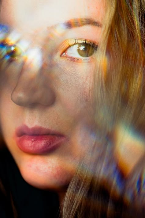 Light reflection prism photoshoot Rainbow Light Photoshoot, Light Refraction Photography, Prism Photography Portrait, Light Shining On Face, Kaleidoscope Photoshoot, Iridescent Portrait, Light Reflection Photography, Prism Photoshoot, Prism Portrait